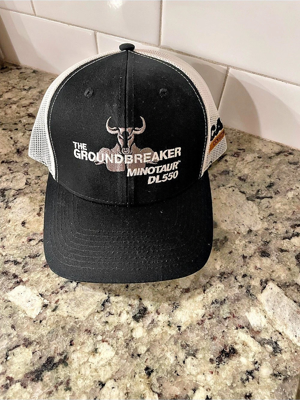 The Groundbreaker Miniature DLS50 Trucker Hat in Black & White